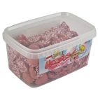 A wholesale tub of pink strawberry flavour chocolate hearts with sprinkles on top